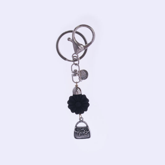 Portachiavi donna con borsetta decorativa e pietra lavica - accessorio elegante con moschettone